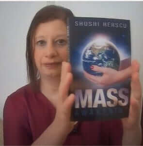 Shoshi holding her book during the video