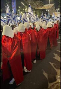 Women protestors dressed in the handmaid's tale costumes in a recent protest in Israel